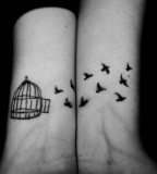 Beautiful Story Caged Birds Tattoos on Both Wrists