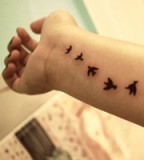 Birds Flying Tattoo Set on Wrist