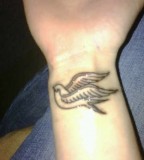 Canary Bird Tattoo Design on Wrist Idea