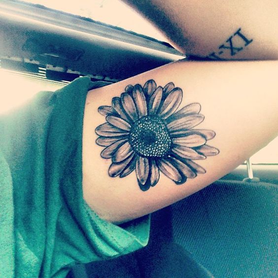black daisy flower tattoo