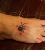 Cute Tiny Black Widow Tattoo on Leg