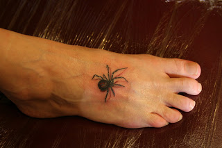 Cute Tiny Black Widow Tattoo on Leg