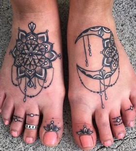 blakc and white foot mandala tattoo