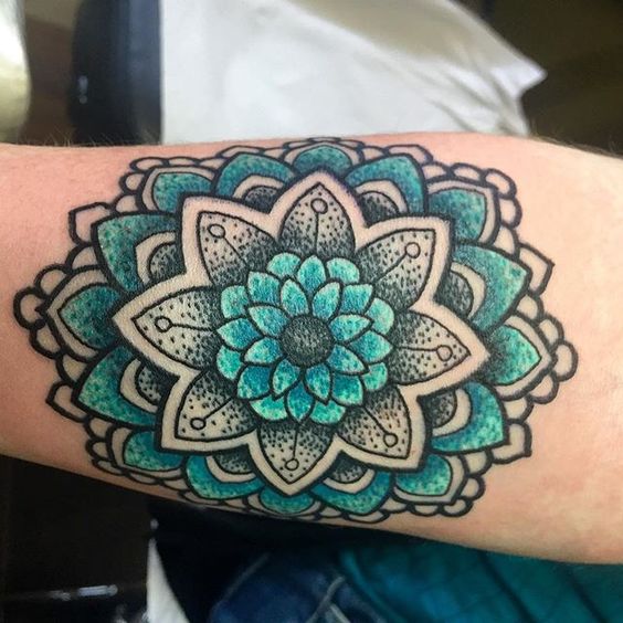 blue and green mandala tattoo