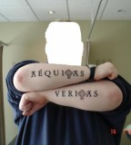 Veritas And Aequitas Tattooed On Forearms, The Words Imply Truth And Justice
