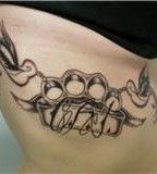 Brass Knuckle Tattoo on Woman's Rib