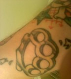 Brass Knuckle Tattoo on Calf