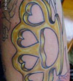 Love Formed Brass Knuckles Tattoo 