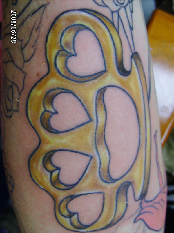 Love Formed Brass Knuckles Tattoo