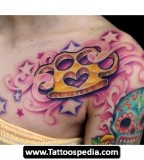 Brass Knuckle Tattoo on Shoulder