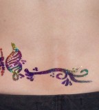 Sparkling Colorful Lower Back Butterfly Tattoo For Women