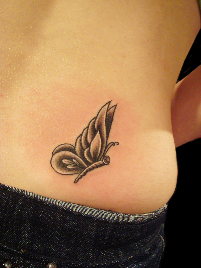 Cute Lower Back Black and White Flying Butterfly Tattoo For Women