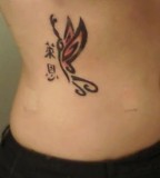 Black Tribal Butterfly Tattoo on Hip