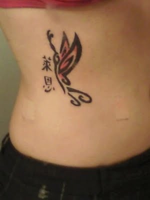 Black Tribal Butterfly Tattoo on Hip