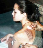 Angelina Jolie Religious Verses Tattoo on Left Back Shoulder