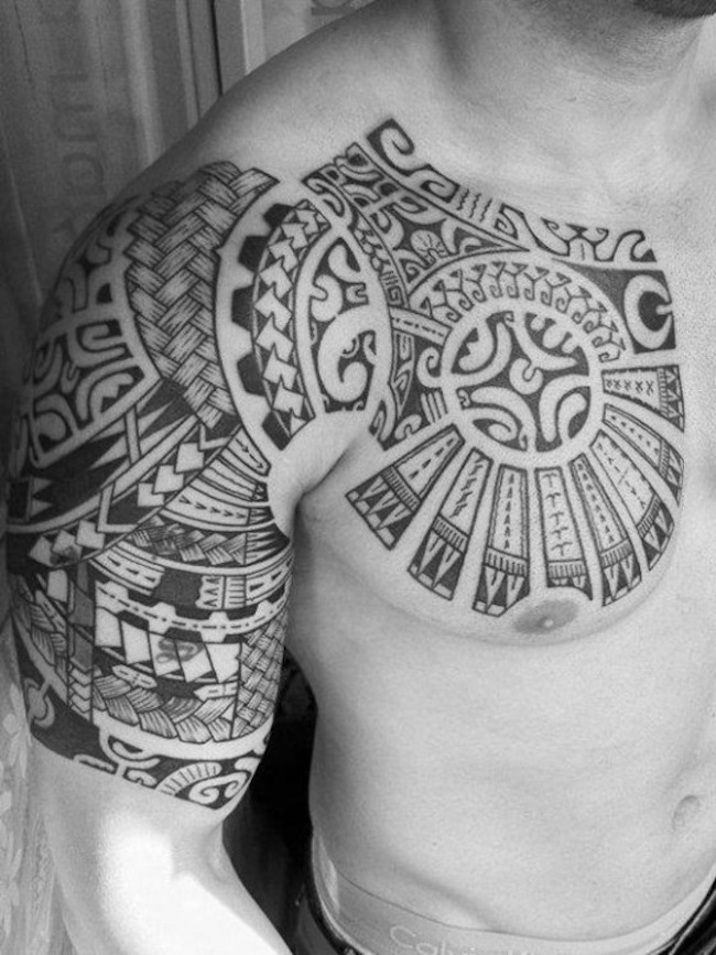 chest and half sleeve tribal tattoo