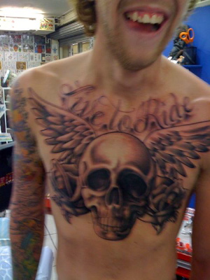 Awesome "Live To Ride" Winged-Skull and Flowers Chest Piece Tattoo Design