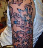 Stars And Clouds Tattoo on Upper Arm for Men