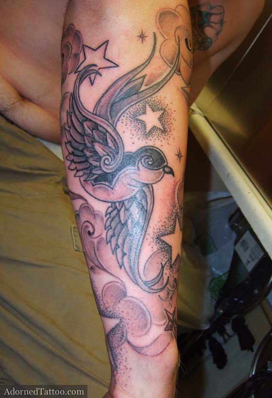 Swallow Forearm Tattoo With Negative Stars And Clouds Adorned