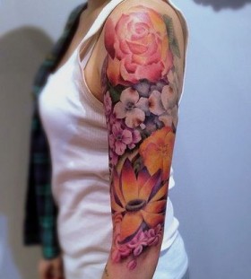 colorful upper arm sleeve flower tattoo