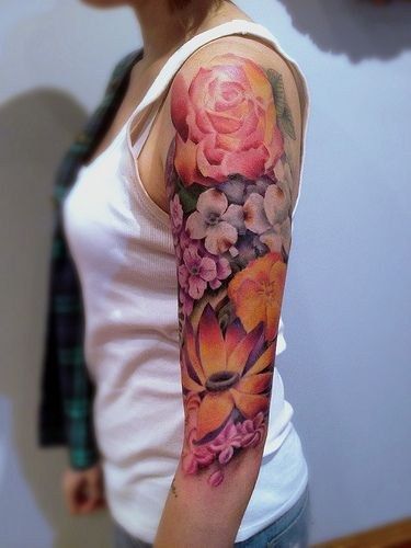 colorful upper arm sleeve flower tattoo