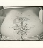 Nautical Compass Tattoo Meaning on Lower Back
