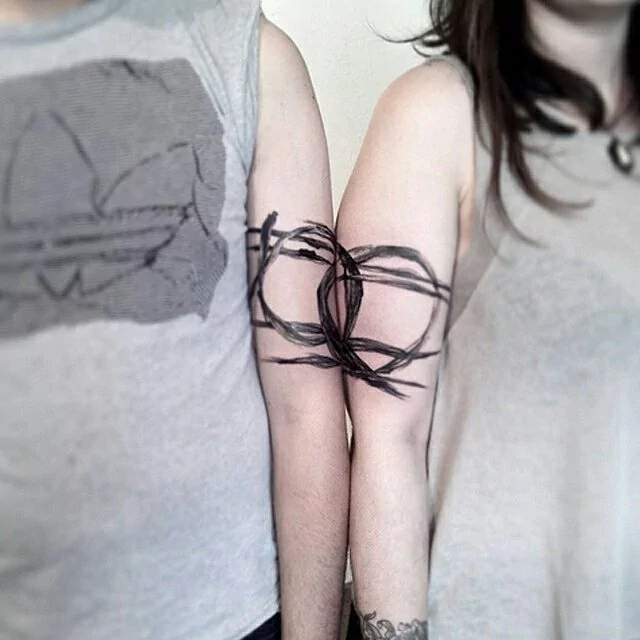 cool couple arm tattoo