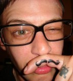 Funny Mustache Tattoo on Pointer Finger Side