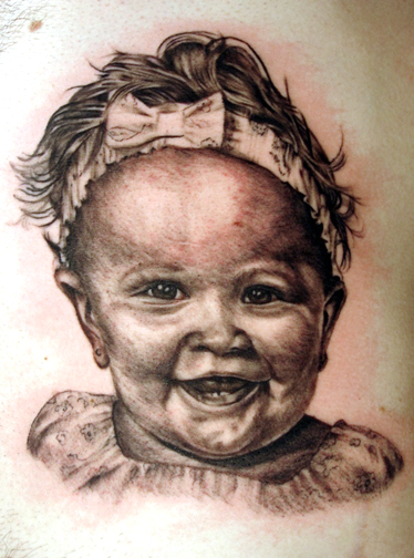 Cute Baby Face Tattoo Design for Guys