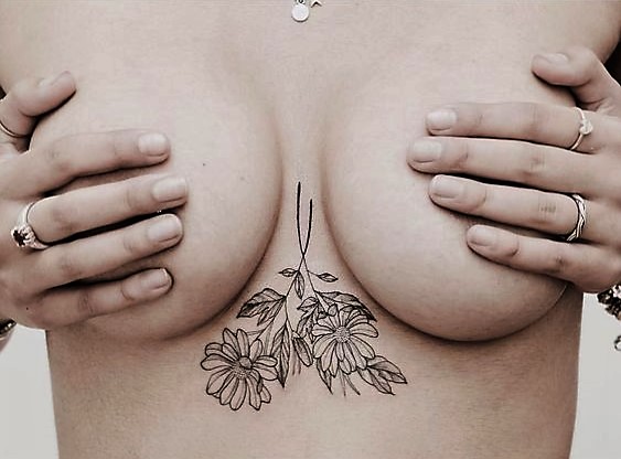 crossed-flower-sternum-tattoo