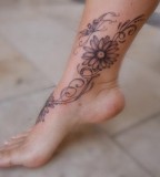Gorgeous Daisy Flower Leg and Angle Tattoo Design for Women