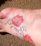 Swirly Red Daisy Flower Tattoo On Foot - Flower Tattoos for Women
