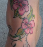 Red Daisy Flower Foot & Ankle Tattoo Design Ideas for Women