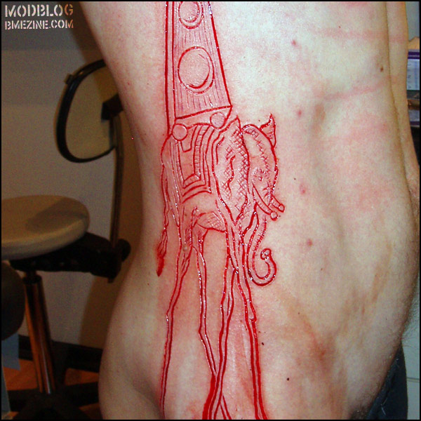 Red Dali Elephant Cutting Tattoo Design for Men and Women