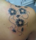 Simple Flower Tattoo On Upper Back