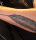 Remarkable Dave Grohl's Feather tattoo Design
