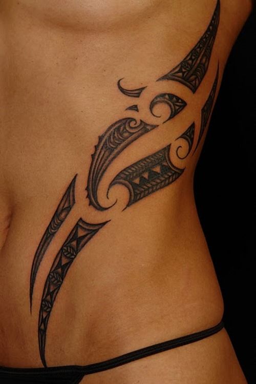 delicate ribcage tribal tattoo