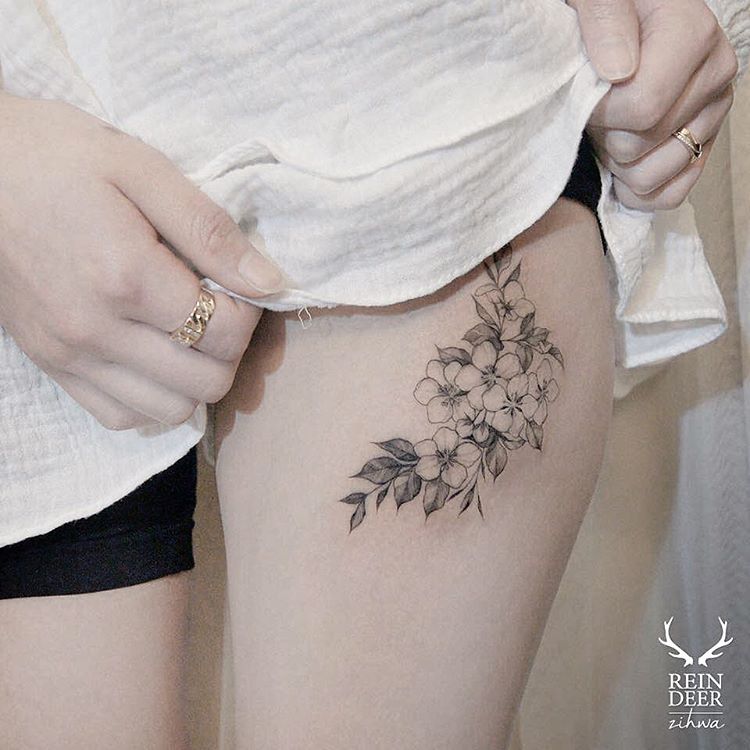 delicate-upper-thigh-flower-tattoo
