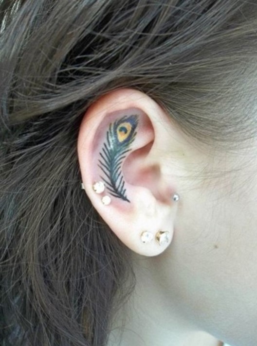 ear feather tattoo