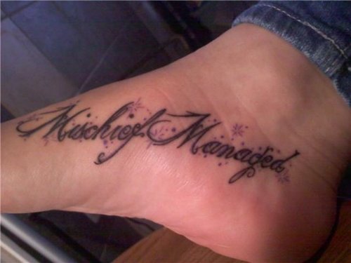 Beautiful Sparkling Professor Lupin of Harry Potter Movie saying “Mischief Managed” Tattoo on Side Leg