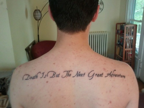 Cool Harry Potter Movie Quote Saying ‘Death Is But The Next Great Adventure’ Tattoo on Upper Back