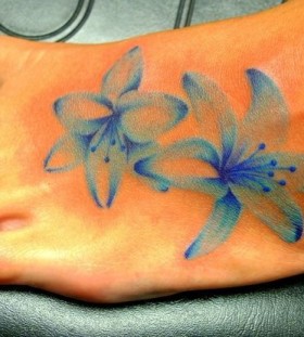 faded blue flower tattoo