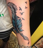 Glamorous Feather Bird Tattoo Inspiration Photo