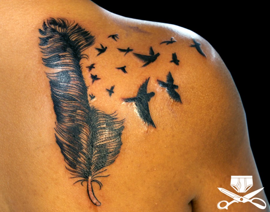 Wonderful Feather And Bird Tattoo Design