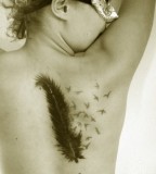 Elegant Feather And Bird Tattoo On The Upper Back