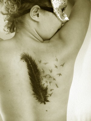 Elegant Feather And Bird Tattoo On The Upper Back