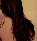 Gorgeous Feather Scatter To Birds Tattoo on Girl's Back Shoulder