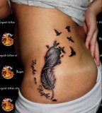 Amazing Ribs Feather into Birds with Inspirational Quote Tattoo