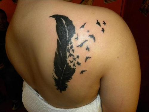 Women Back Feather into Birds Tattoo