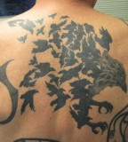 Awesome Flock Of Birds Back Tattoo 